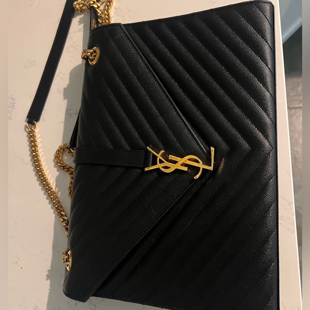 Large black YSL envelope bag. No scratches. Gently used. New condition.